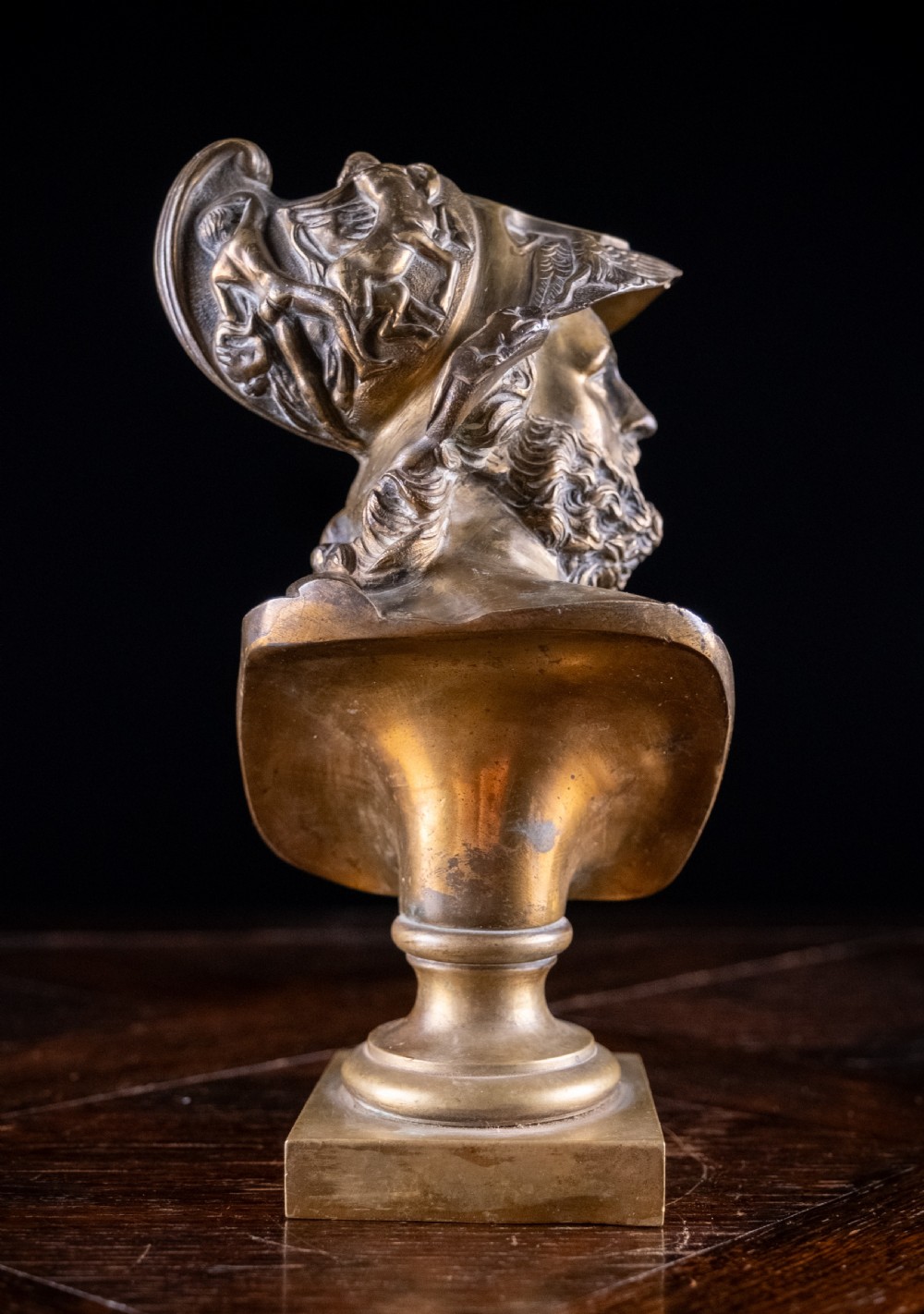 A nineteenth-century gilt bronze sculptural bust depicting the classical hero Ajax in profile, wearing an ornate helmet and mounted on a turned pedestal base. View IX