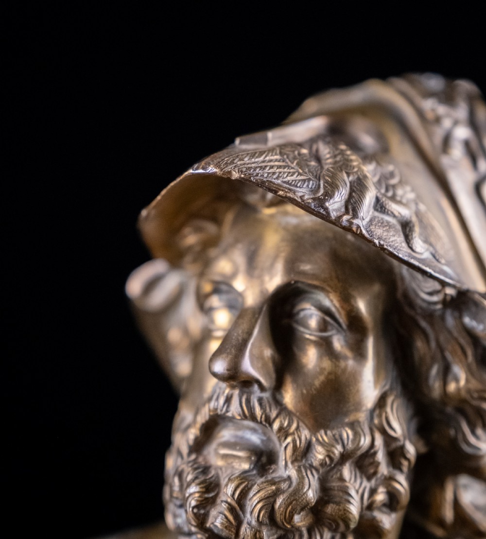 A nineteenth-century gilt bronze sculptural bust depicting the classical hero Ajax in profile, wearing an ornate helmet and mounted on a turned pedestal base. View XIII