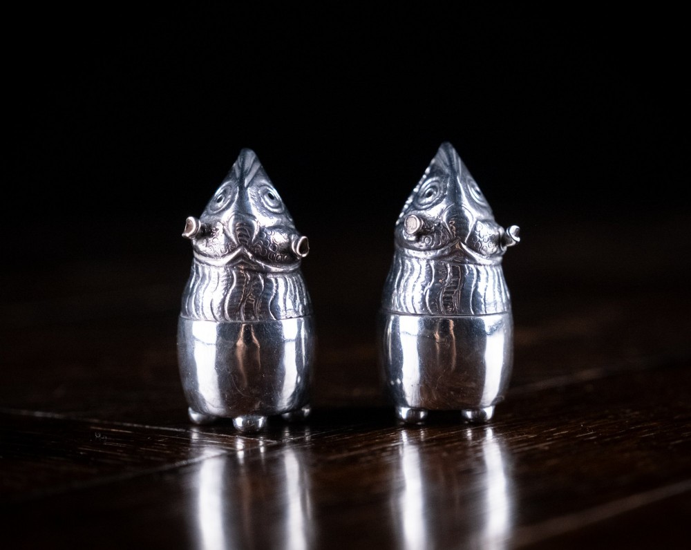 A pair of Victorian sterling silver novelty pepper pots shaped as grotesque birds smoking pipes. View II