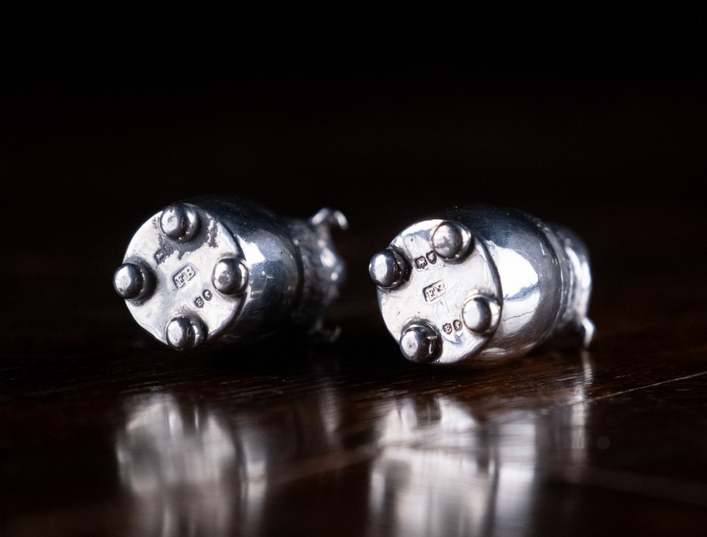 A pair of Victorian sterling silver novelty pepper pots shaped as grotesque birds smoking pipes. View VIII