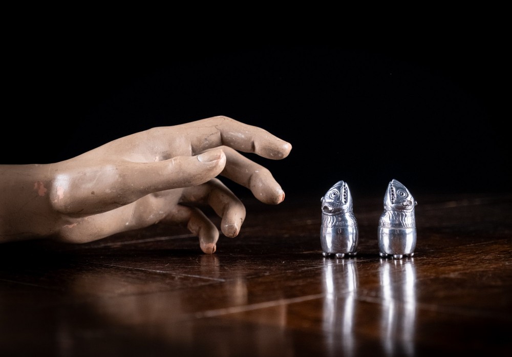 A pair of Victorian sterling silver novelty pepper pots shaped as grotesque birds smoking pipes. View IX