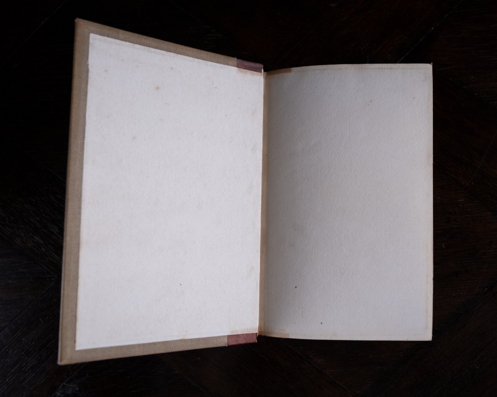 A two-volume set of 1899 first edition books titled The Life of William Morris, bound in brown leather spines with gilt lettering and cream cloth boards. View VII