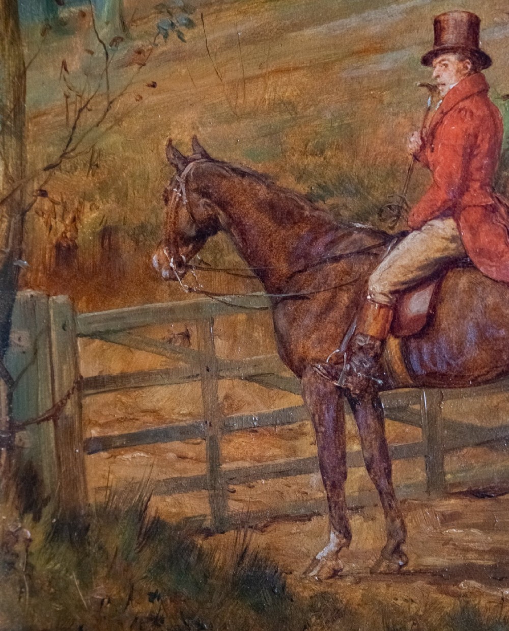 A 19th-century oil painting on panel depicting a gentleman in a red hunting coat atop a horse next to a timber gate in autumn woods. View II