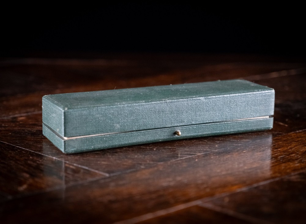 A set of four sterling silver animal-themed menu holders featuring a stag, horse, dog, and hare, presented inside a fitted green display box. View XI