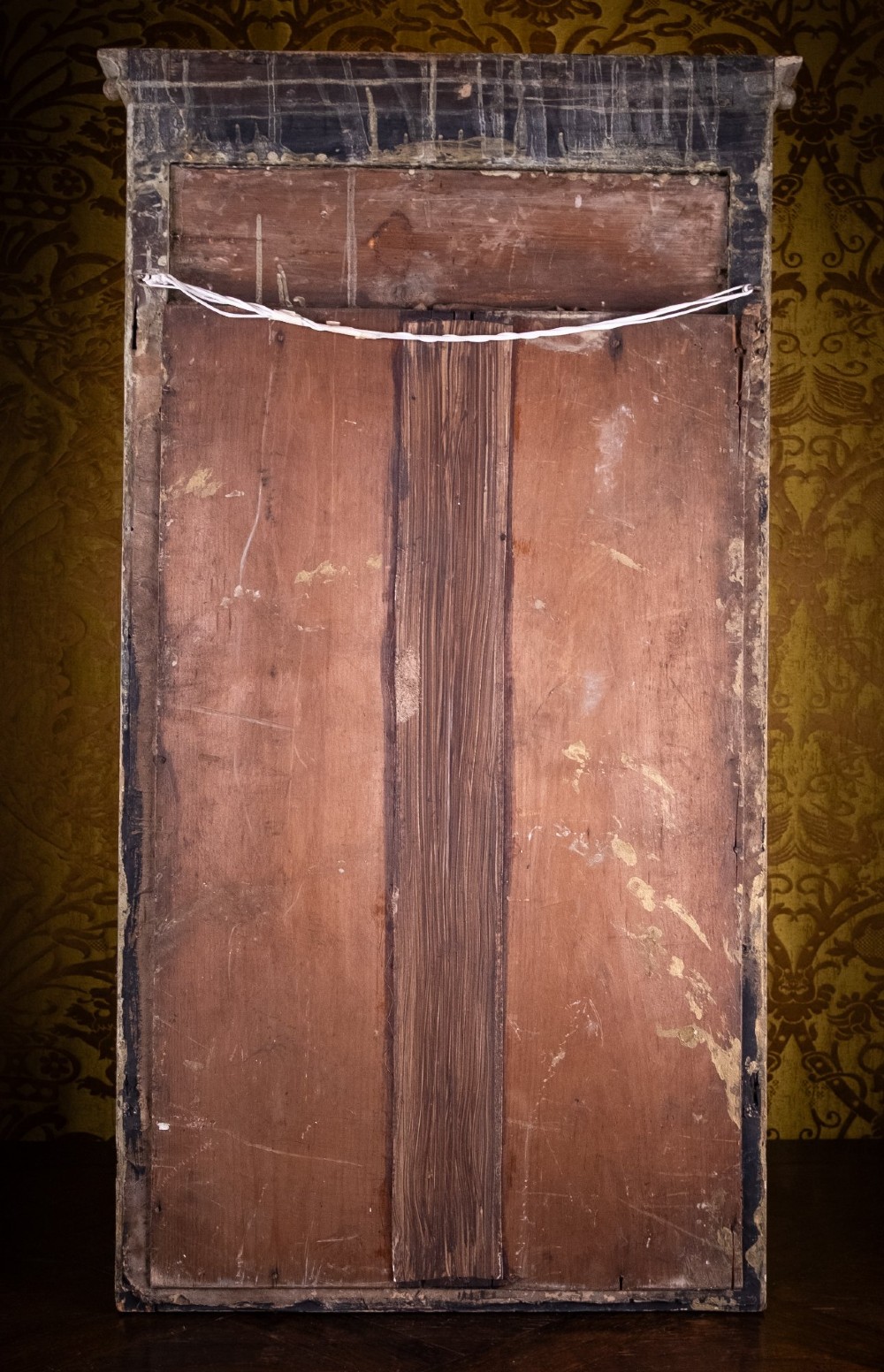 A large Regency style painted and gilded pier mirror featuring classical fluted columns, lion mask corner accents, a ball-ornament cornice, and distressed mirror glass. View XV