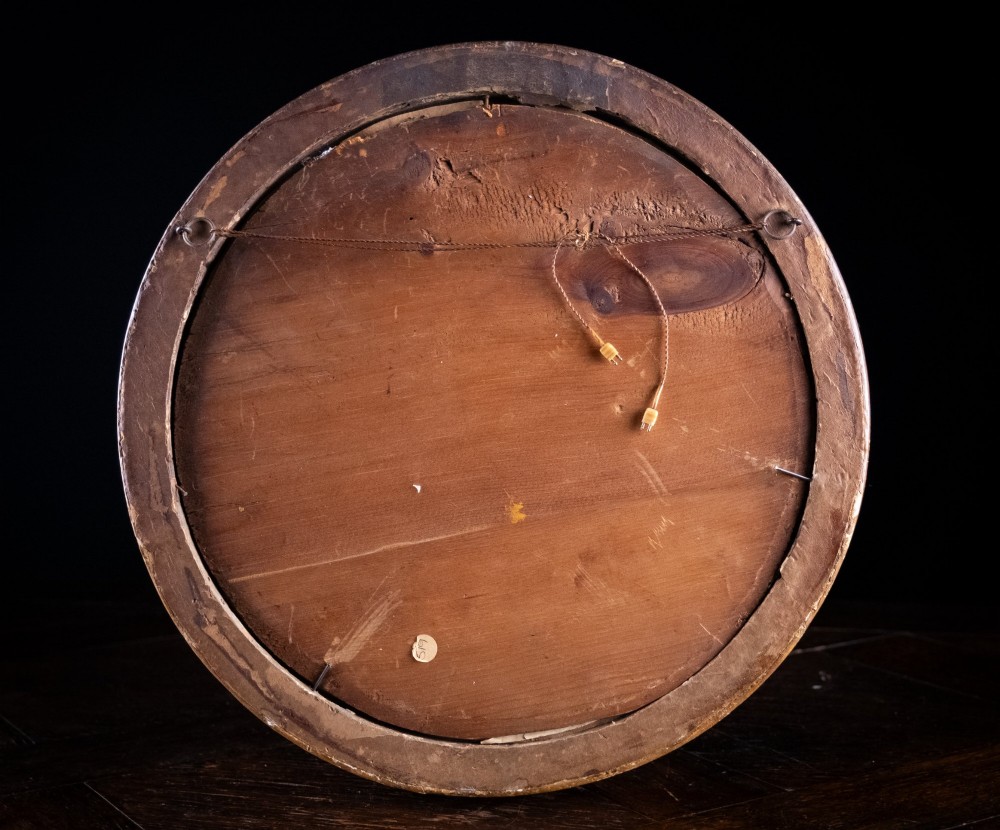 An eighteenth-century circular monochrome engraving depicting winged angels among clouds, set within a carved circular giltwood frame. View VIII
