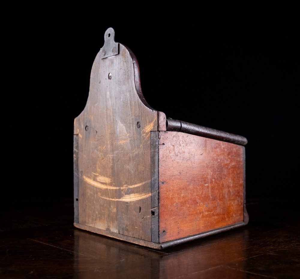 A nineteenth-century reddish-brown painted wooden wall-hanging salt box featuring gilt lettering reading SALT, a sloping hinged lid, and a small bottom drawer. View XIII