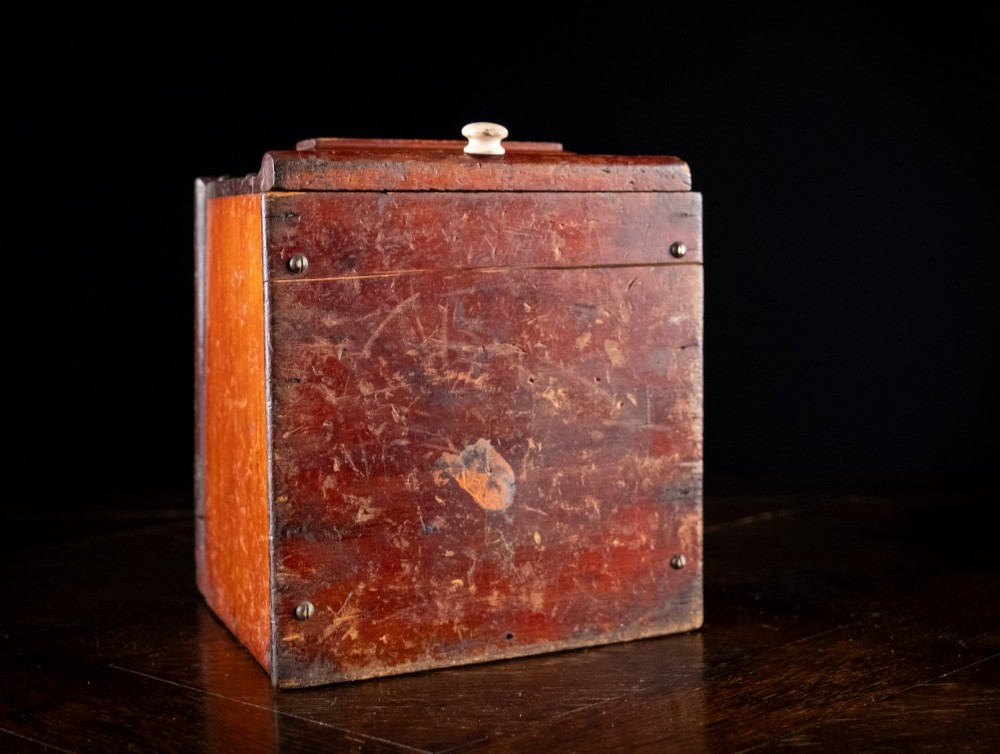 A nineteenth-century reddish-brown painted wooden wall-hanging salt box featuring gilt lettering reading SALT, a sloping hinged lid, and a small bottom drawer. View XIV