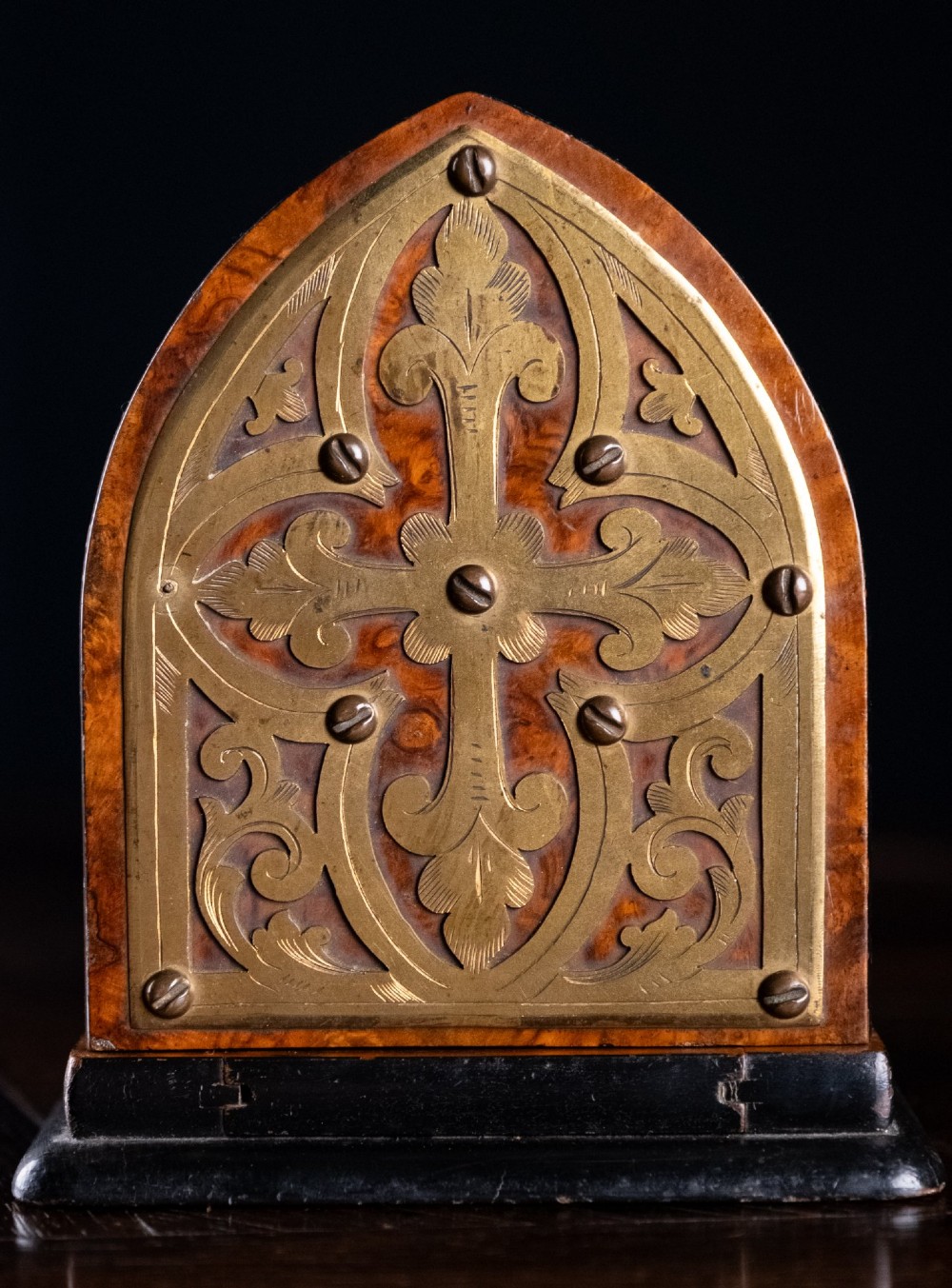 An antique dark walnut extending book slide featuring arched gothic ends detailed with pierced and engraved brass mounts. View V