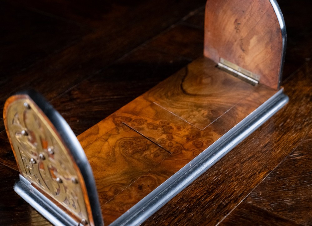An antique dark walnut extending book slide featuring arched gothic ends detailed with pierced and engraved brass mounts. View VI