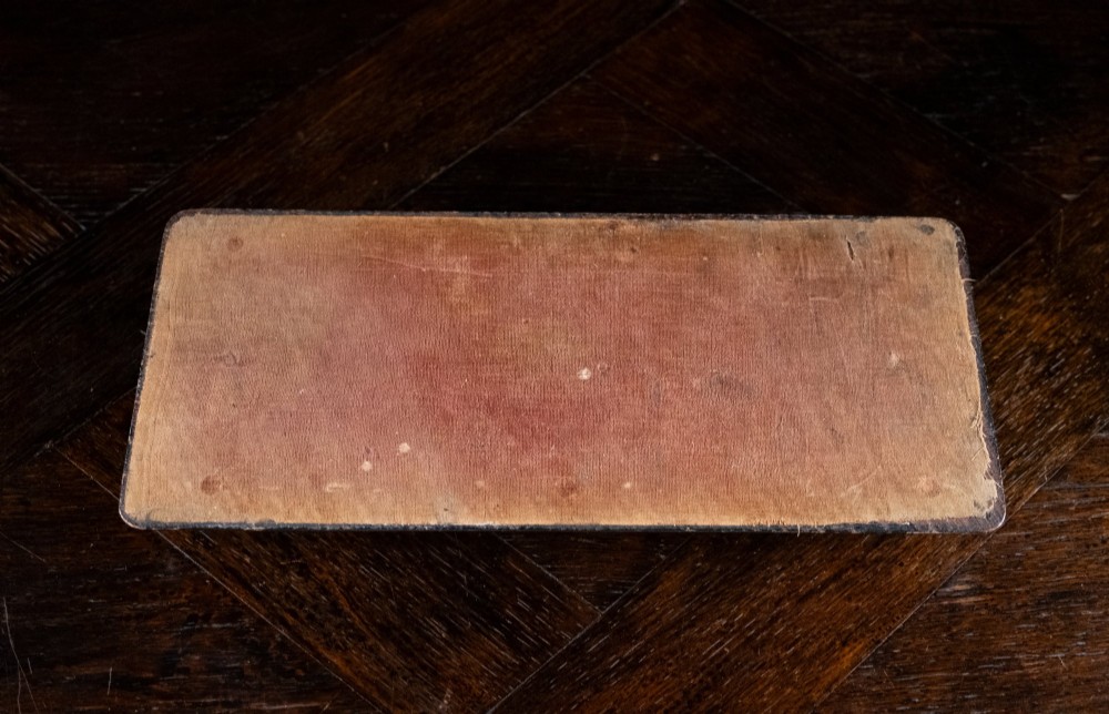 An antique dark walnut extending book slide featuring arched gothic ends detailed with pierced and engraved brass mounts. View VIII