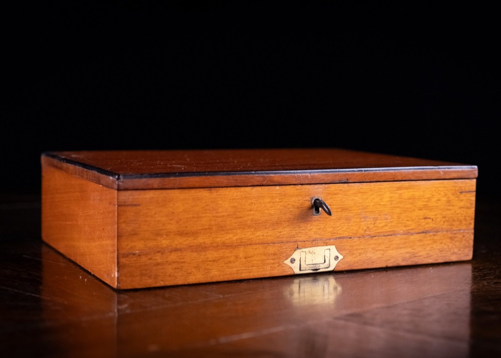 A Victorian mahogany artist watercolour box featuring an open lid lined with blue gilt-stamped paper, fitted compartments containing colour cakes, glass dishes, and a lower drawer holding a ceramic palette. View XIV