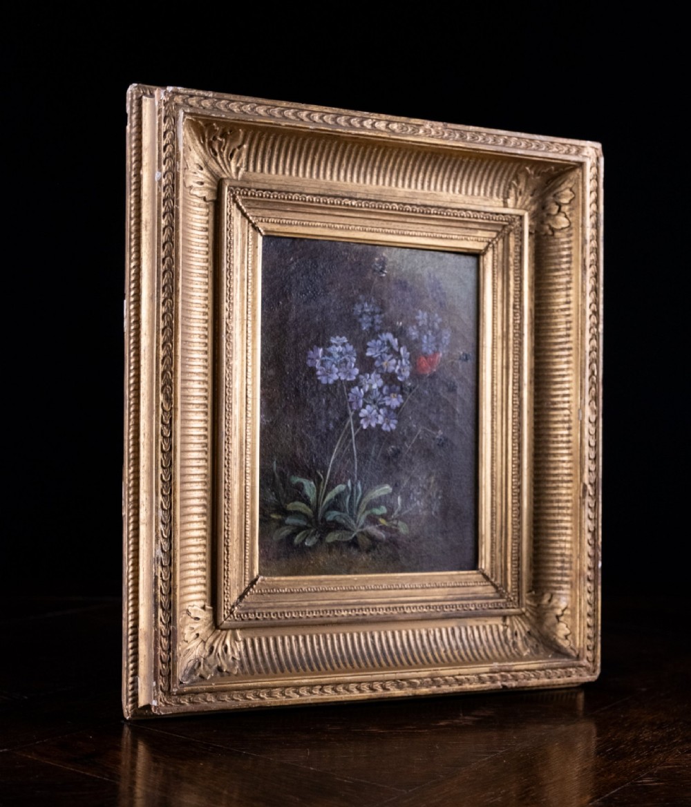 A 19th-century oil painting on canvas depicting purple flowers and a small red butterfly set within an ornate fluted gilt frame. View VI