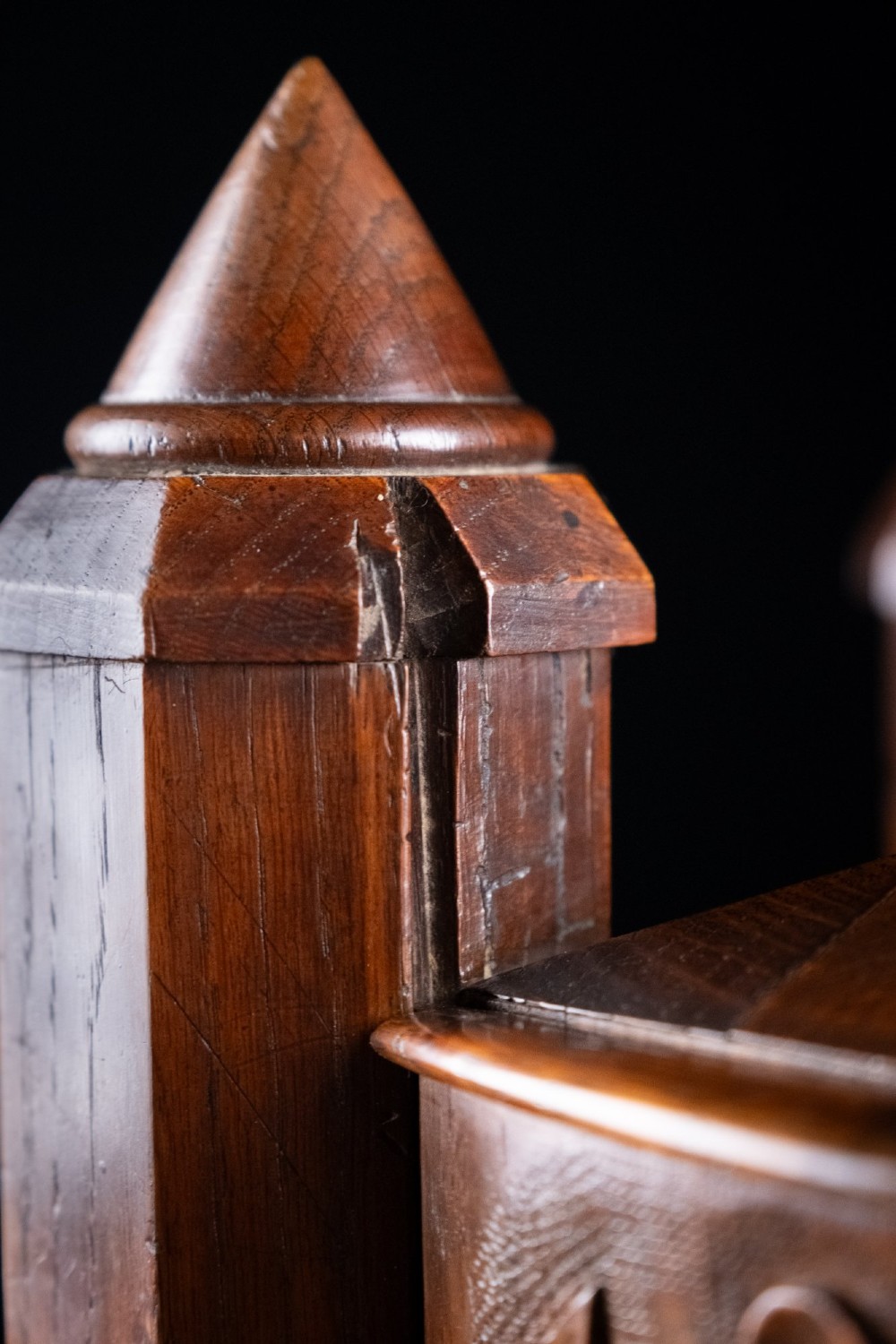 A 19th-century carved oak jewellery box designed like a castle with four corner turrets, floral relief panels, and small drawers. View XI