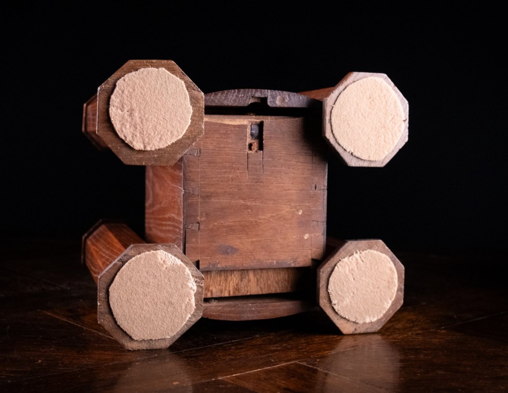 A 19th-century carved oak jewellery box designed like a castle with four corner turrets, floral relief panels, and small drawers. View XIV