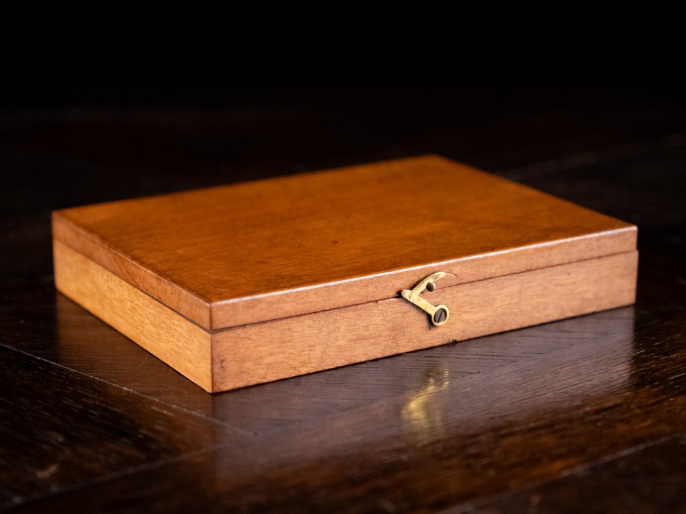 An open Victorian mahogany watercolour box displaying pigment cakes, four round porcelain mixing dishes, and an illustrated inner lid label reading Superior Water Colors. View VII