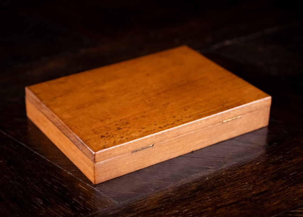An open Victorian mahogany watercolour box displaying pigment cakes, four round porcelain mixing dishes, and an illustrated inner lid label reading Superior Water Colors. View VIII