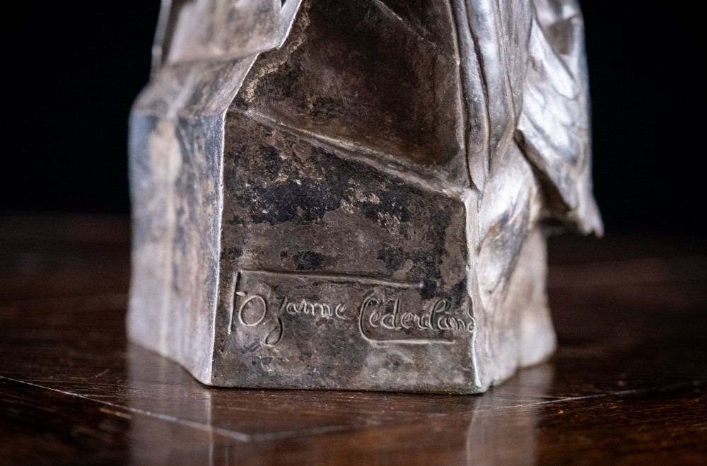 A patinated nickel bronze sculpture depicting two pigeons embracing atop a geometric plinth. View IV