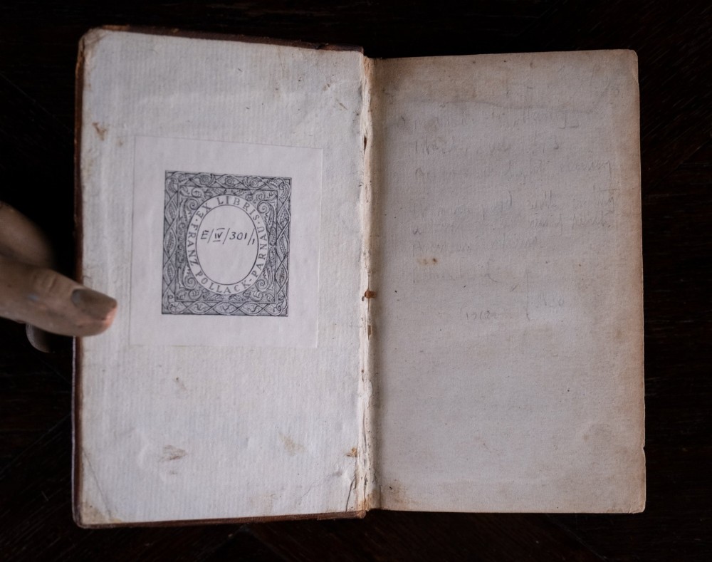 A two-volume set of 1773 brown leather-bound books titled The Man of the World with gilt lettering on the spines. View VI