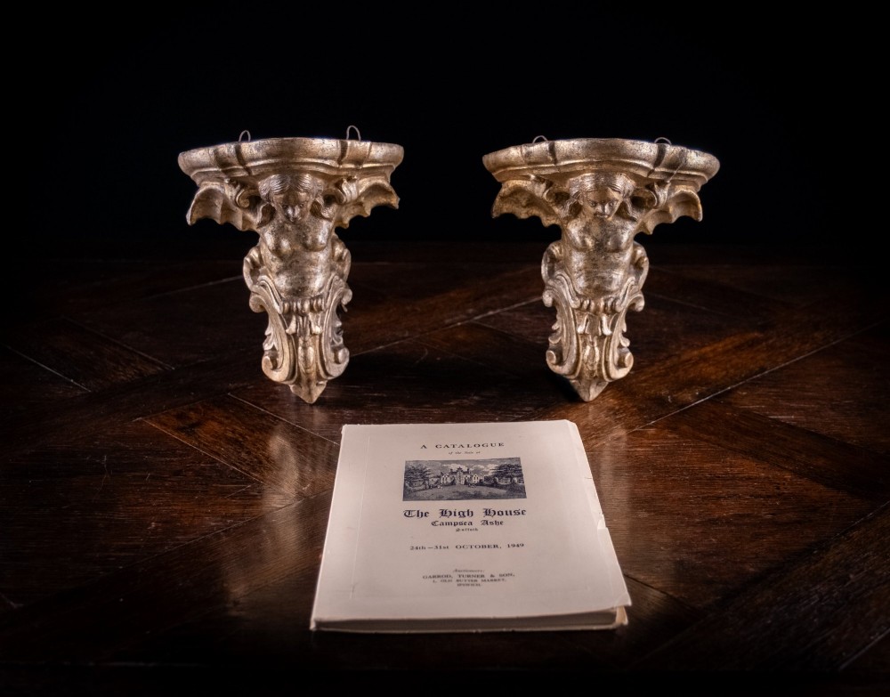 A pair of late nineteenth-century gilt terracotta wall brackets featuring winged siren figures above acanthus scrollwork pedestals. View II