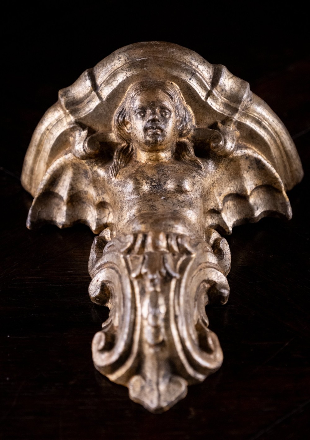 A pair of late nineteenth-century gilt terracotta wall brackets featuring winged siren figures above acanthus scrollwork pedestals. View IV