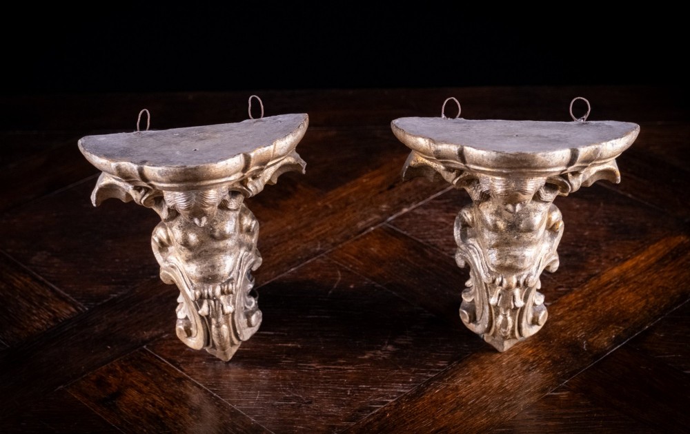 A pair of late nineteenth-century gilt terracotta wall brackets featuring winged siren figures above acanthus scrollwork pedestals. View VIII