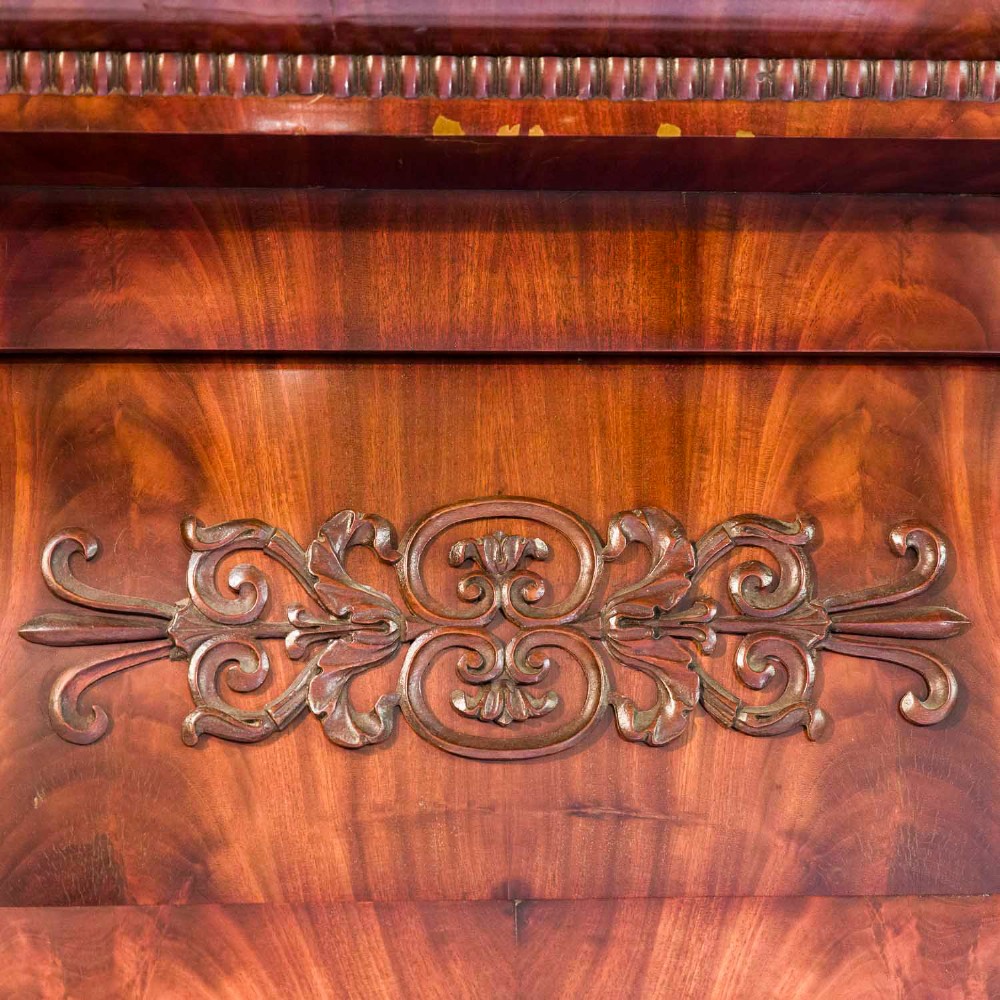 A tall rectangular mahogany pier mirror featuring carved classical columns, flame veneer upper frieze with carved scroll details, and a moulded cornice top. View II