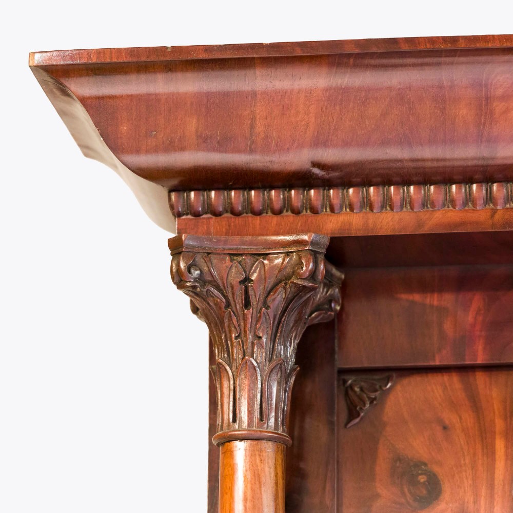 A tall rectangular mahogany pier mirror featuring carved classical columns, flame veneer upper frieze with carved scroll details, and a moulded cornice top. View III