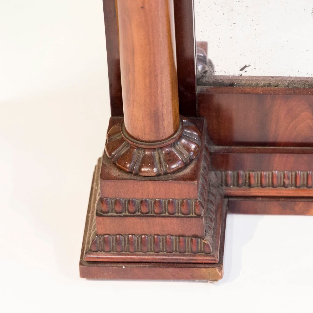 A tall rectangular mahogany pier mirror featuring carved classical columns, flame veneer upper frieze with carved scroll details, and a moulded cornice top. View IV