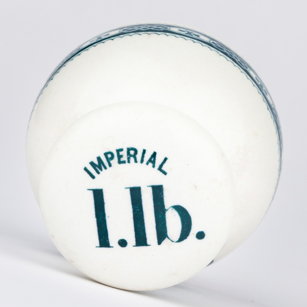 A pair of white glazed ceramic shop scale weights decorated with blue transfer-printed text and scroll borders for W and T Avery Birmingham. View V