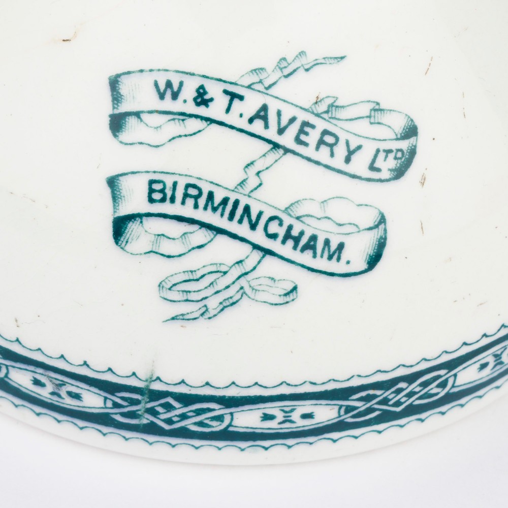 A pair of white glazed ceramic shop scale weights decorated with blue transfer-printed text and scroll borders for W and T Avery Birmingham. View VI
