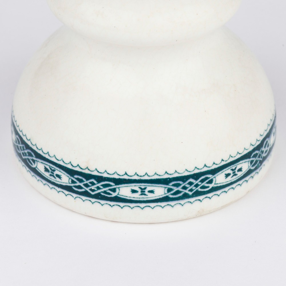 A pair of white glazed ceramic shop scale weights decorated with blue transfer-printed text and scroll borders for W and T Avery Birmingham. View VII