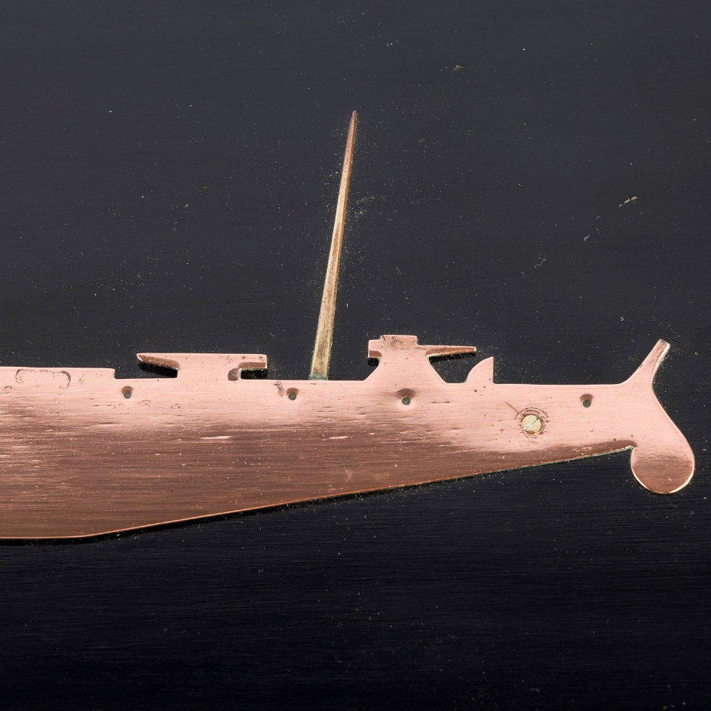 A rectangular black lacquered wooden plaque displaying a copper cutout profile of HMS Tartar 1906 with a small brass title tag below. View VI