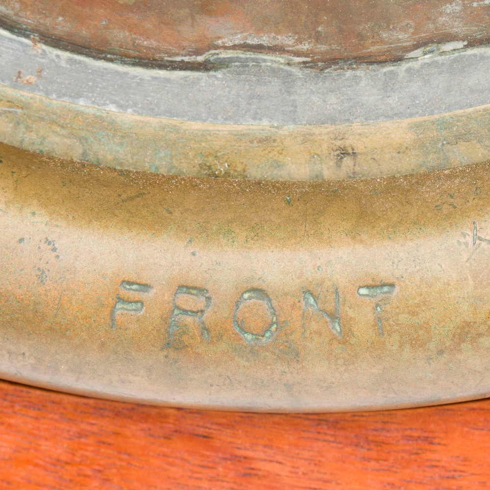 An antique Siebe Gorman copper and brass deep-sea diving helmet with a central circular viewport and lateral window grilles. View IV