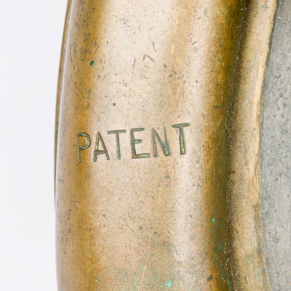 An antique Siebe Gorman copper and brass deep-sea diving helmet with a central circular viewport and lateral window grilles. View VI