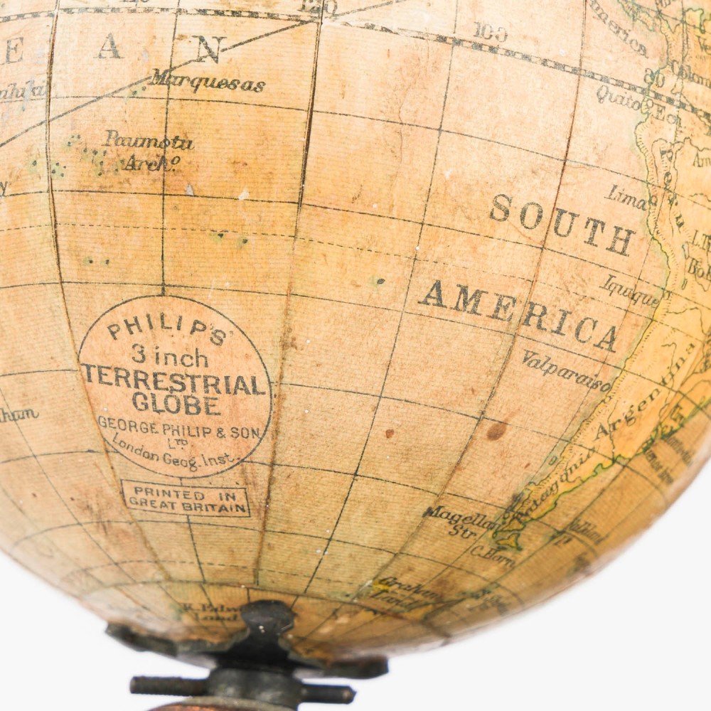 A Victorian Parkes and Hadley patent tellurian orrery featuring a cast metal base with calendar markings, interlocking gears, and a small terrestrial globe with a moon attachment. View X