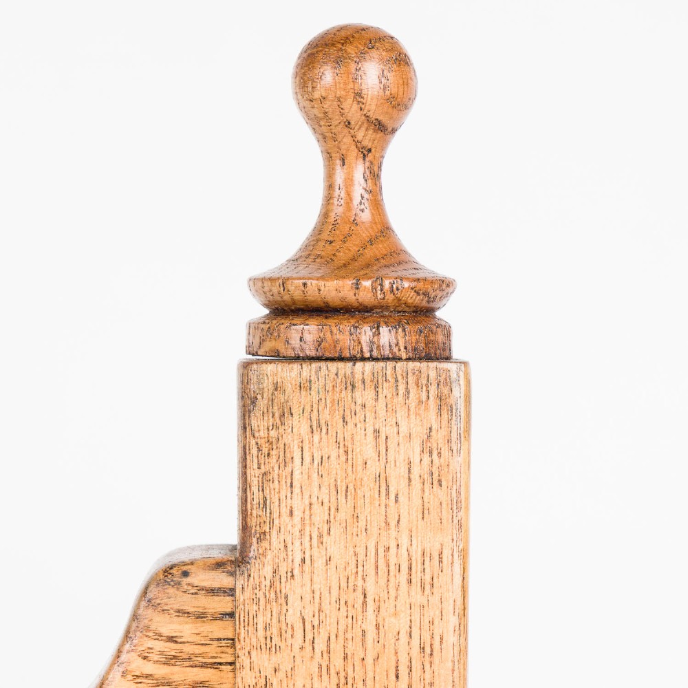 A polished brass Royal Navy ships bell engraved HMS Roysterer 1919, suspended inside a light oak wooden frame. View VII