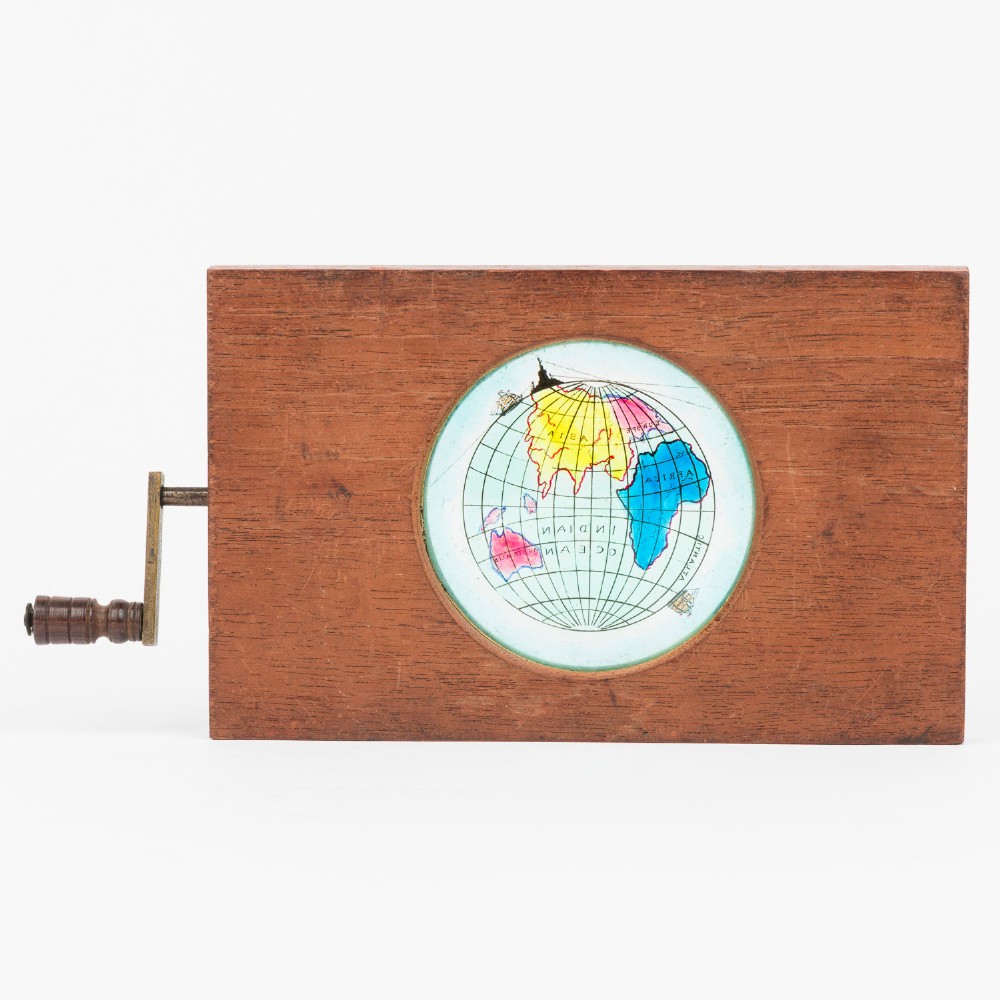 A pair of rectangular mahogany-framed mechanical magic lantern slides featuring hand-coloured astronomical glass apertures and brass hand cranks. View II