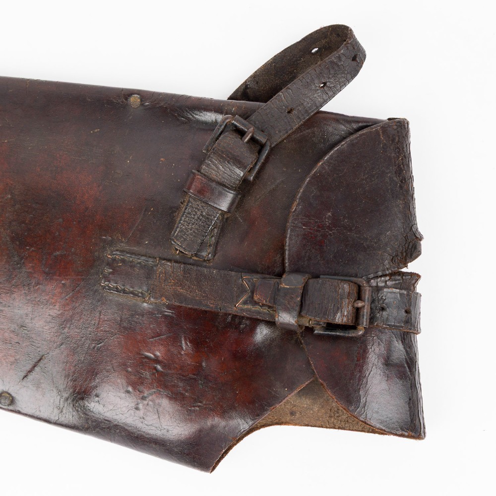 An antique steel hand saw featuring a patinated blade with visible teeth and a shaped wooden handle secured with metal rivets. View VIII