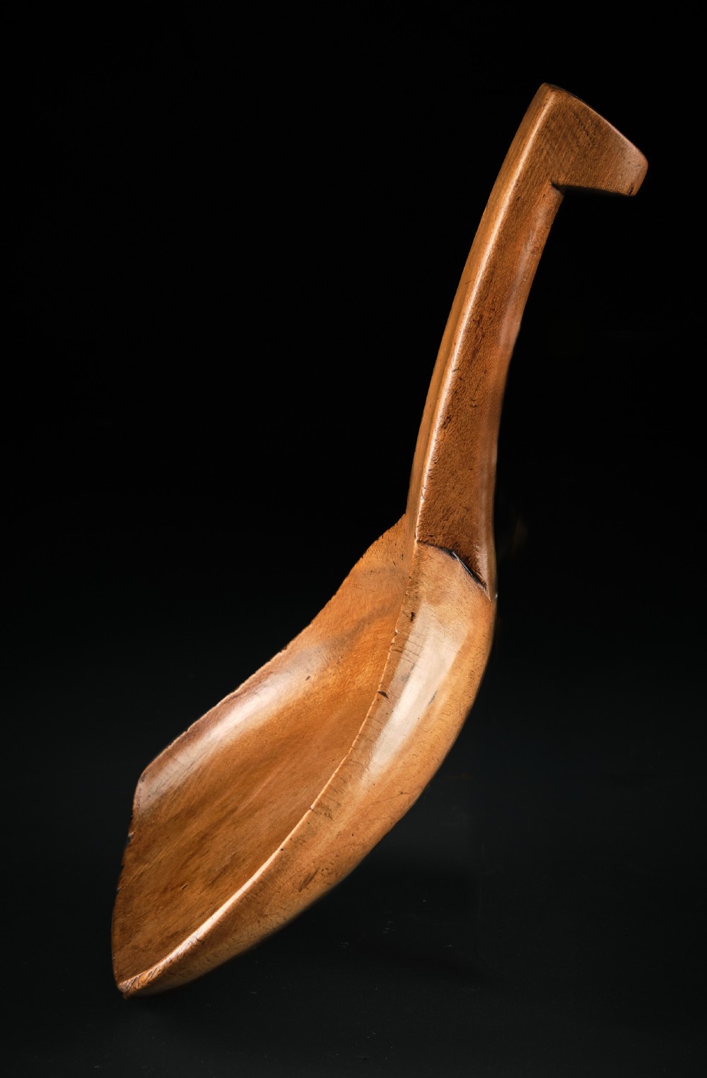 A hand-carved antique Welsh sycamore wooden scoop featuring a straight flat handle and a flared wide shallow bowl. View III