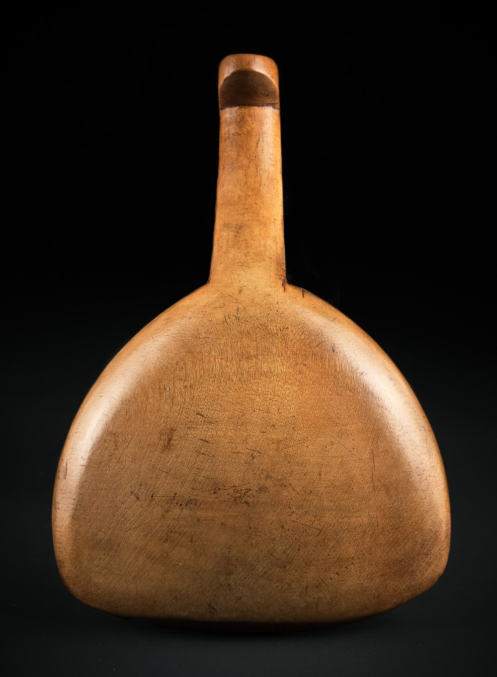 A hand-carved antique Welsh sycamore wooden scoop featuring a straight flat handle and a flared wide shallow bowl. View V
