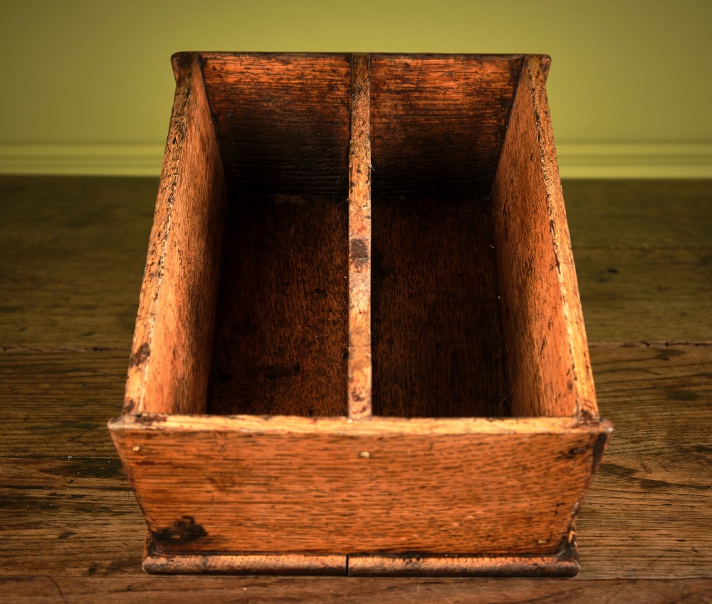 A rectangular Victorian oak cutlery box featuring two divided compartments and a raised central carrying handle. View II