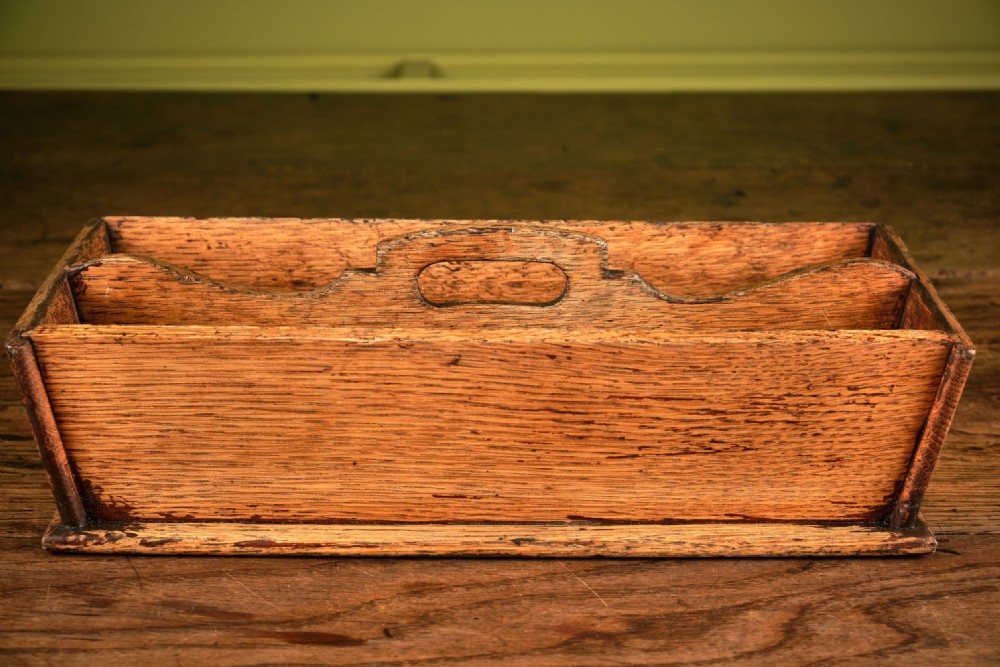A rectangular Victorian oak cutlery box featuring two divided compartments and a raised central carrying handle. View III