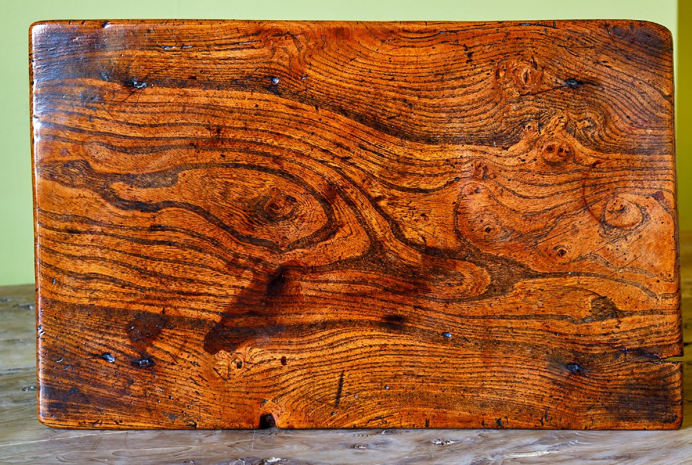 A small early 18th-century dark oak and elm occasional table featuring turned legs, a plank top, and lower stretchers. View VI