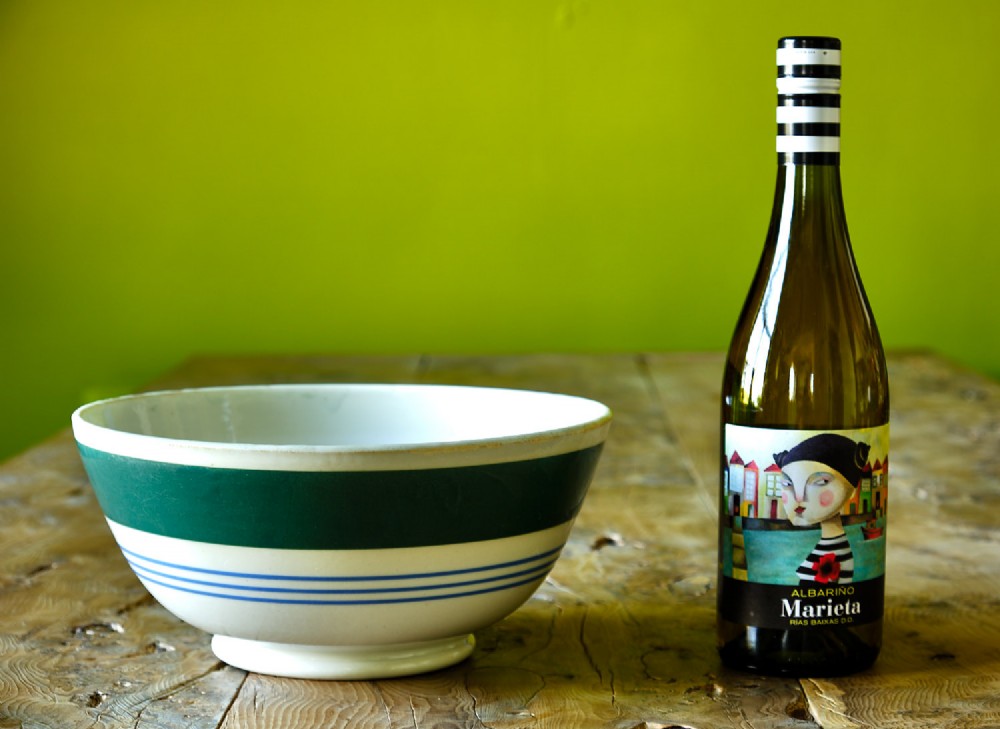 A white ceramic mixing bowl featuring a wide horizontal green band near the rim and three thin blue stripes around the lower body. View III