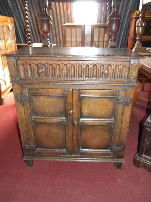 Oak Cupboard with Two Doors and Carved Draw