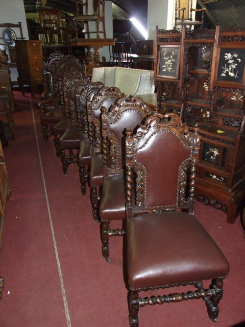A Set of 8 Carved Oak Chairs