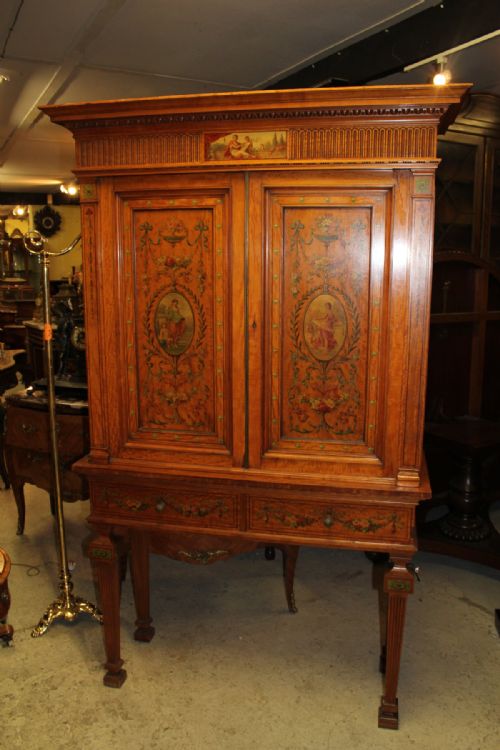 A Satinwood Painted Cabinet on Stand in Neoclassical Style
