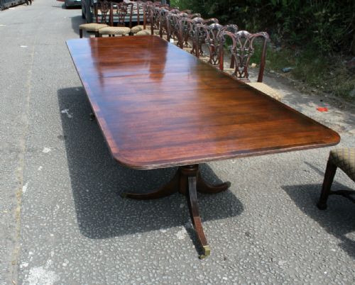 An Early 20th Century 3 Leaf Mahogany Twin Pillar Dining Table