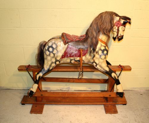 A Childs Antique Wooden Rocking Horse